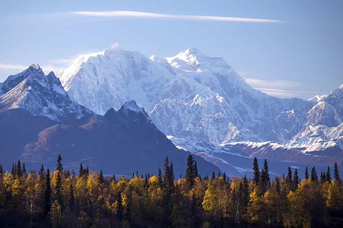 The distinctive peaks of Denali National Park in Alaska rise dramatically from the plains.