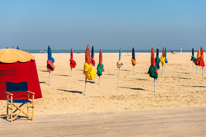 Colourful beach umbrellas at Deauville on the Normandy coast