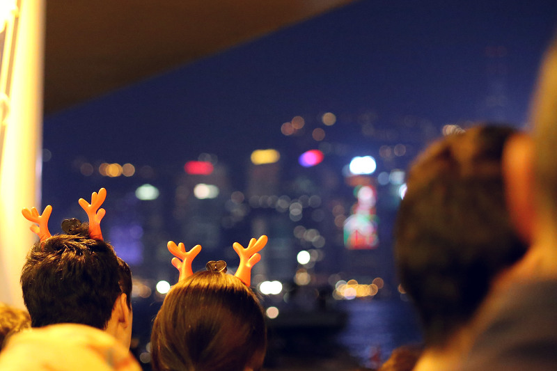 people wearing christmas antlers