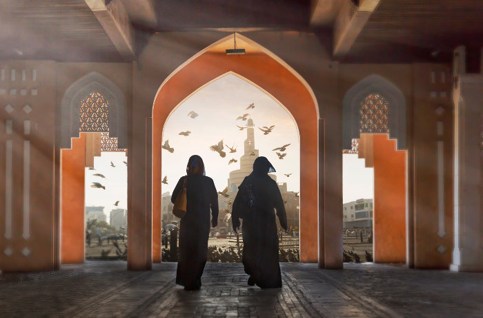 two women in india under arch