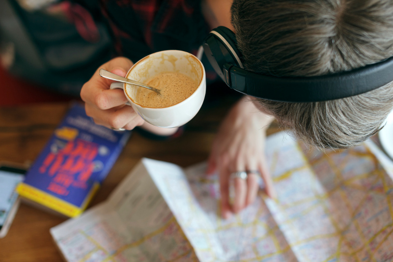 Woman looking at travel map