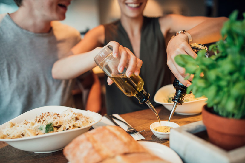 man and woman at table in italian restaurant