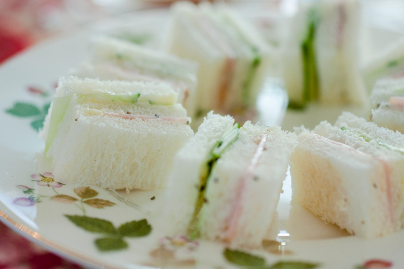Little sandwiches arranged on a plate