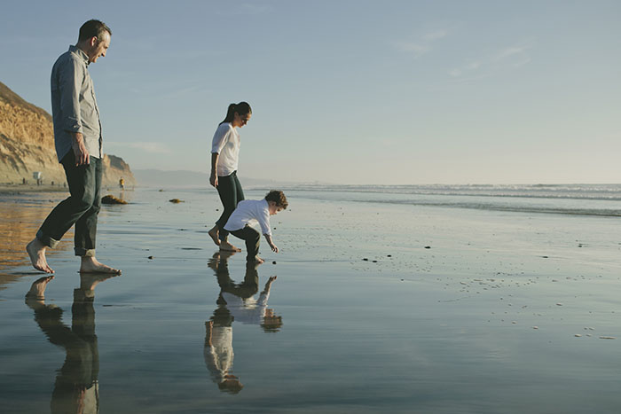 family on beach in southern california