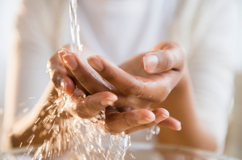 A woman washing her hands