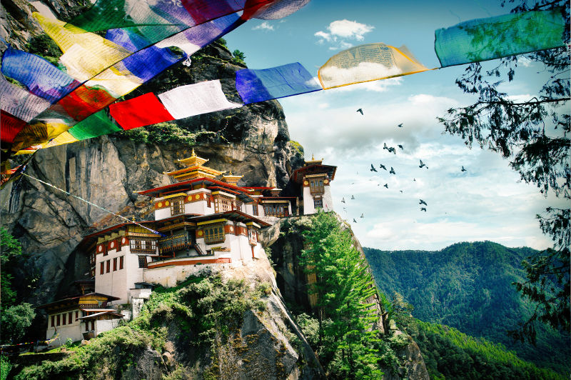 A Buddhist monastery clings to a hillside in Bhutan.