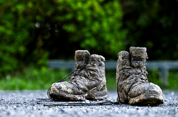A pair of muddy hiking boots