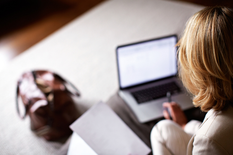 A woman working in her hotel room