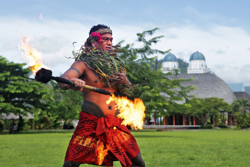 Samoan male dancer fire twirling