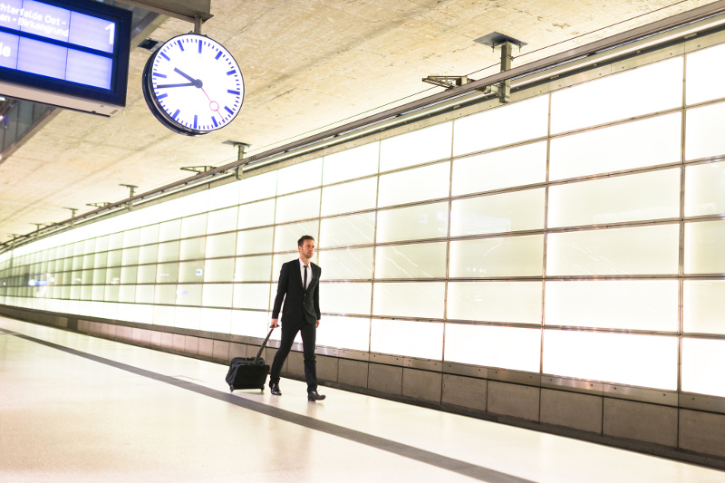 A man walking on a train platform