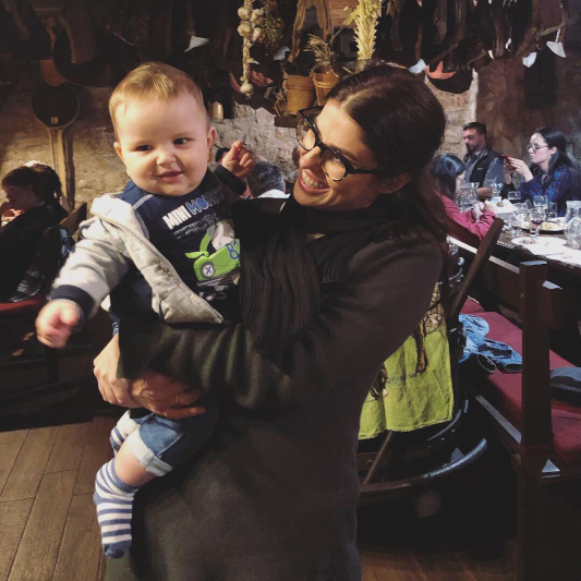 Sheridan holding a Croatian baby roughly 12 months old