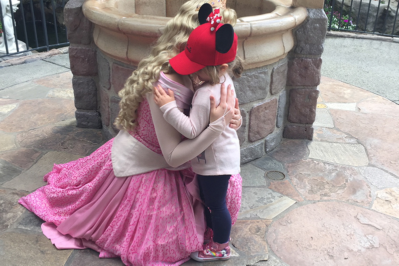 Child hugs princess at Disneyland Resort, Anaheim