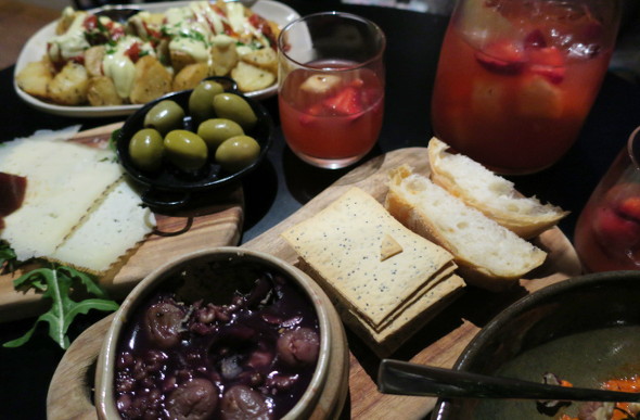 Table filled with tapas and sangria jug