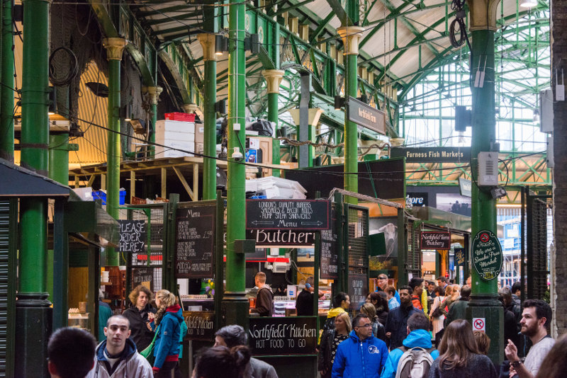 Shoppers walking through London's Borough Market.