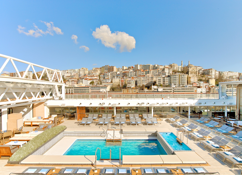 Main pool with deck chairs around the pool