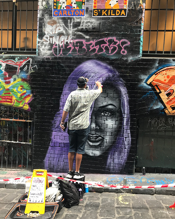 Street artist in Melbourne's laneways