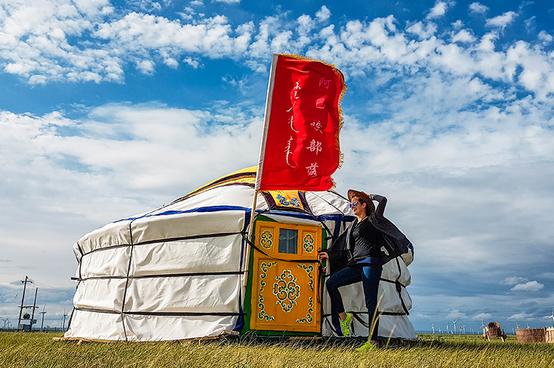 Woman outside yurt in Mongolia