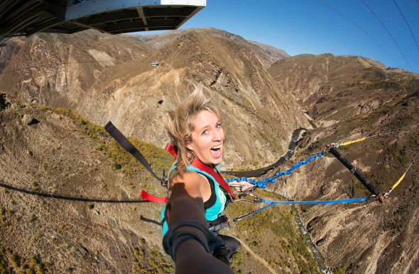 A woman screams at AJ Hackett Bungy's attraction in Queenstown, New Zealand.