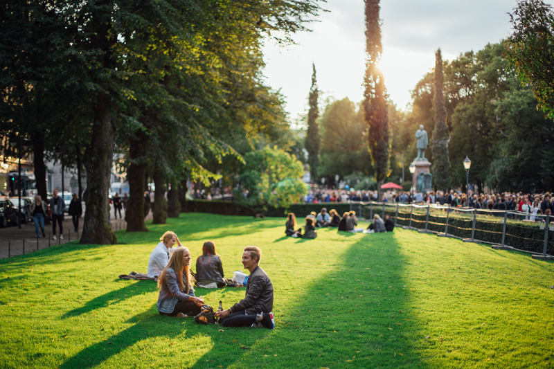couple relaxing in park in Helsinki, Finland during summer