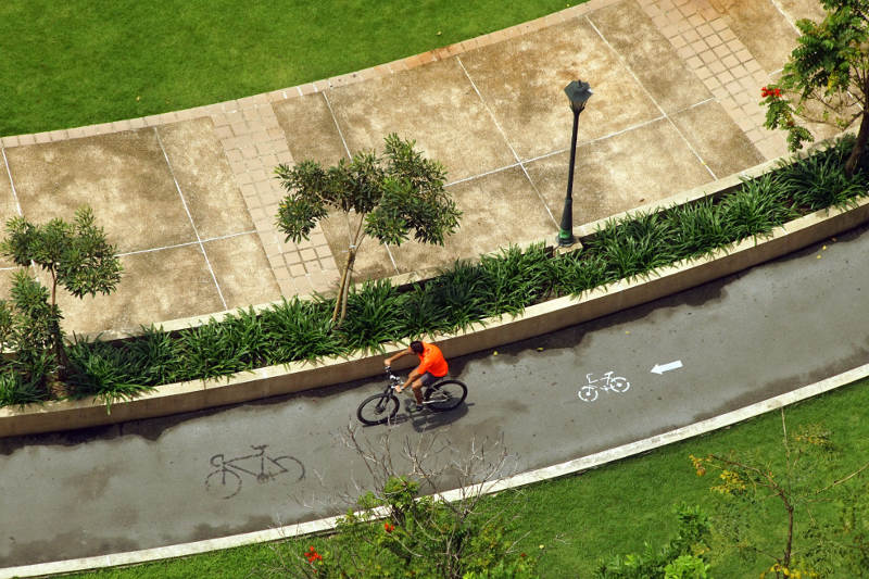 Man riding bicycle in Bangkok, Thailand