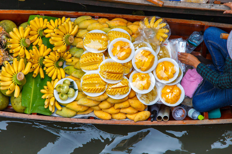 Longtail boat with fruit on it, from floating market near Bangkok