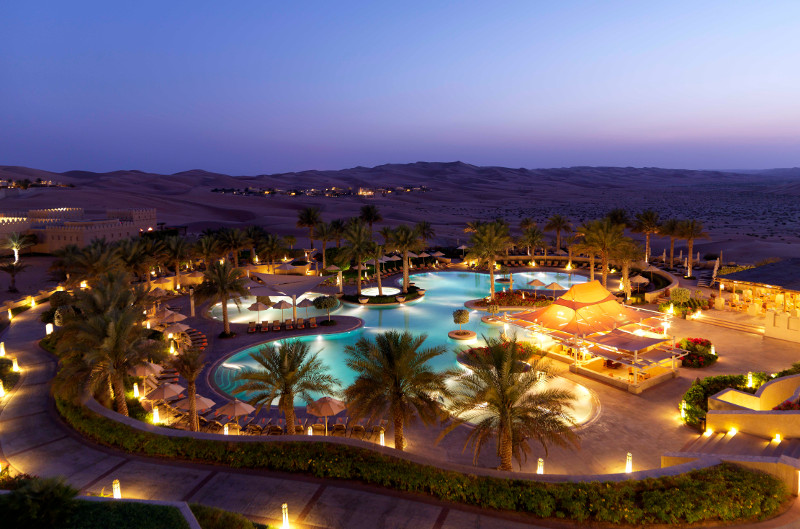 luxury hotel in desert pool at sunset luxury hotel in desert pool at sunset