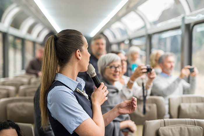 host telling stories on board rocky mountaineer