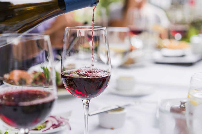 A glass of red wine is poured in a restaurant in Santa Barbara, California.