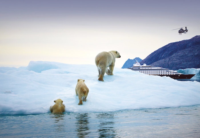 Scenic Eclipse luxury cruise sails through Antarctica with polar bears looking on in the foreground