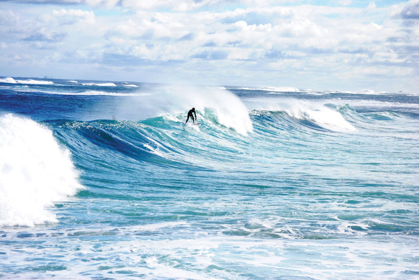 surfer on wave margaret river western australia
