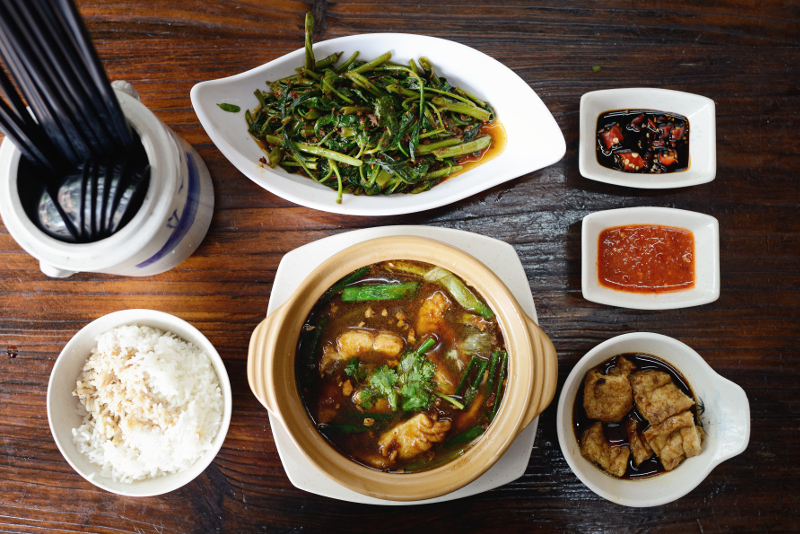 Plates of food on table in Singapore.