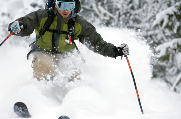 A skier swishing through the snow