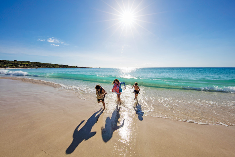 family running on beach in margaret river western australia
