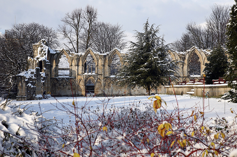 St Mary's Abbey in York covered in snow in wintertime.