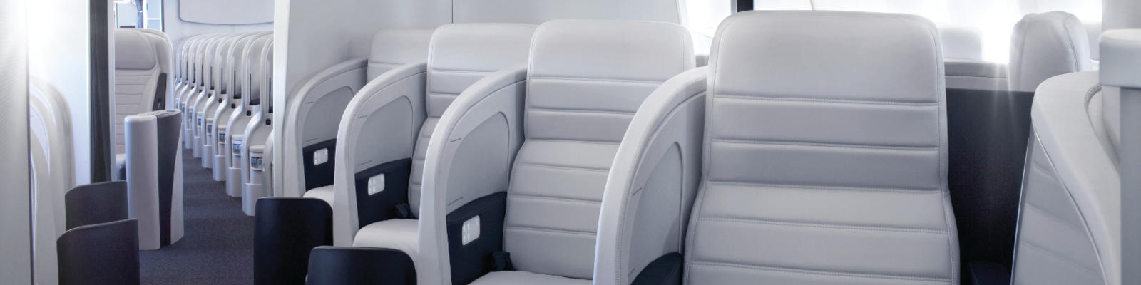 A view up the aisle of the Business Class cabin of an Air New Zealand plane