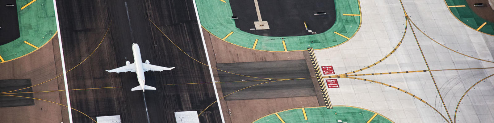 Planes on the tarmac, viewed from above.