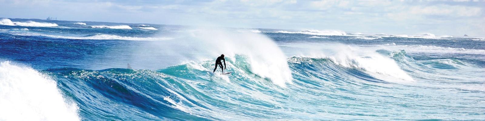 Surfer catching a wave