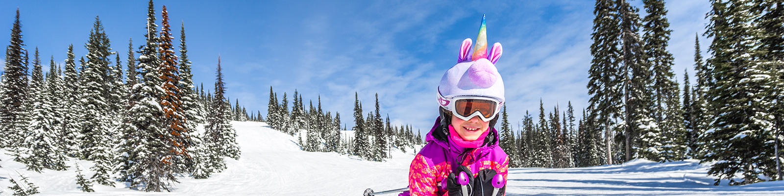 girl skiing on the slopes at Big White Cananda, dressed as a unicorn. Credit: Big White Ski Resort