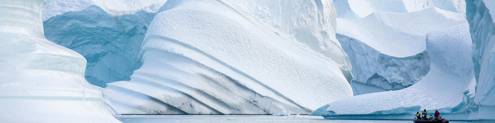 greenland expedition zodiac infront of icebergs