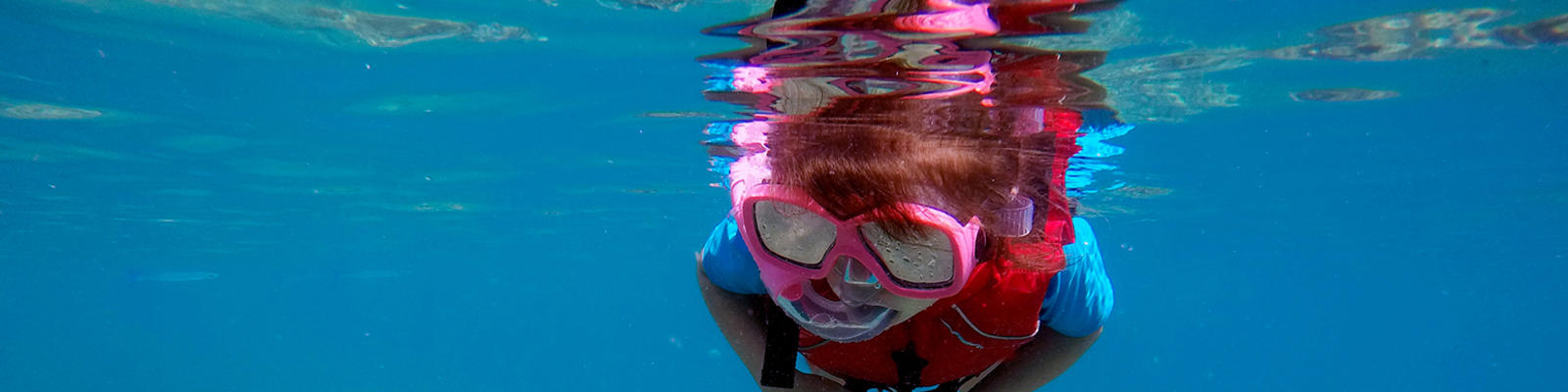 Child snorkelling in Fiji