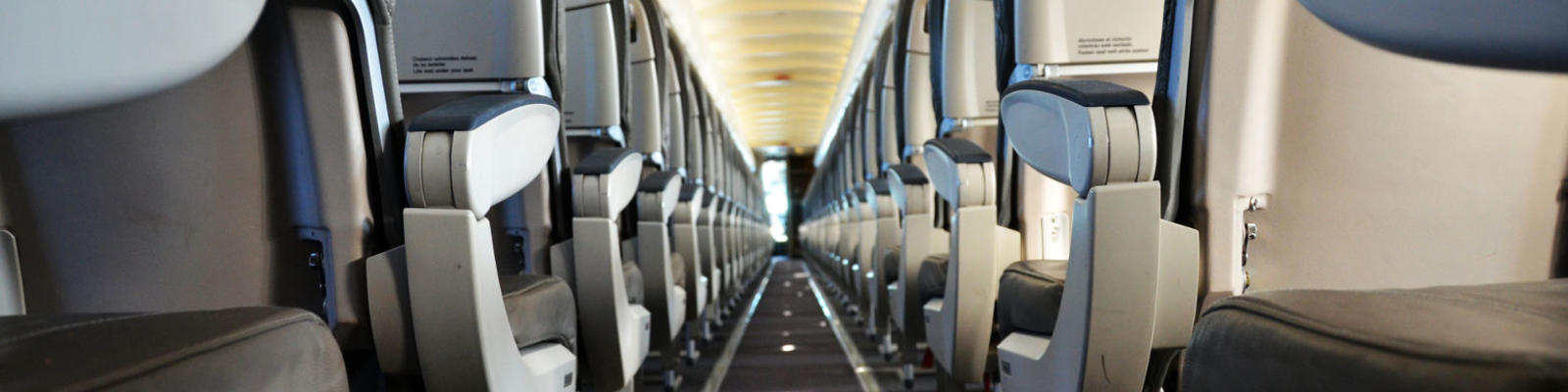 looking down centre aisle of aircraft