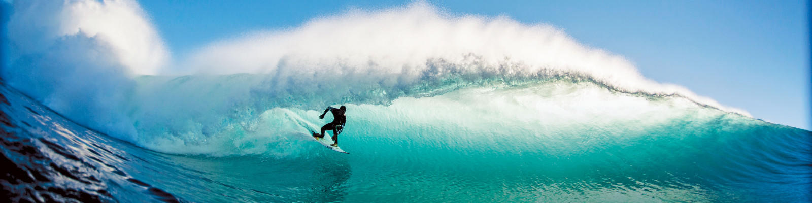 surfer riding breaking wave