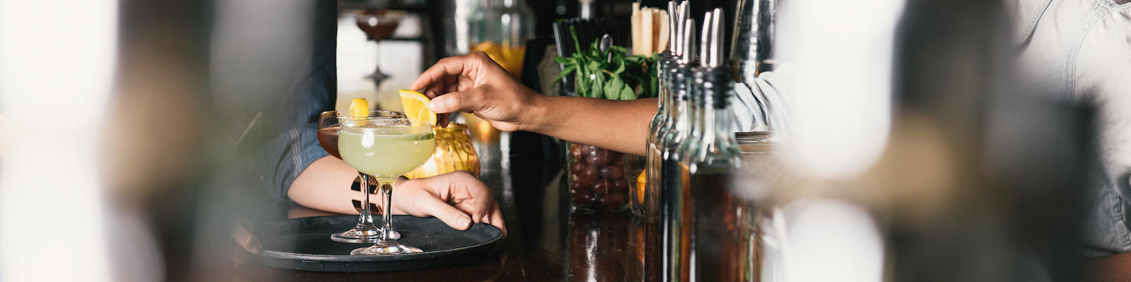NYC cocktail being served at a bar
