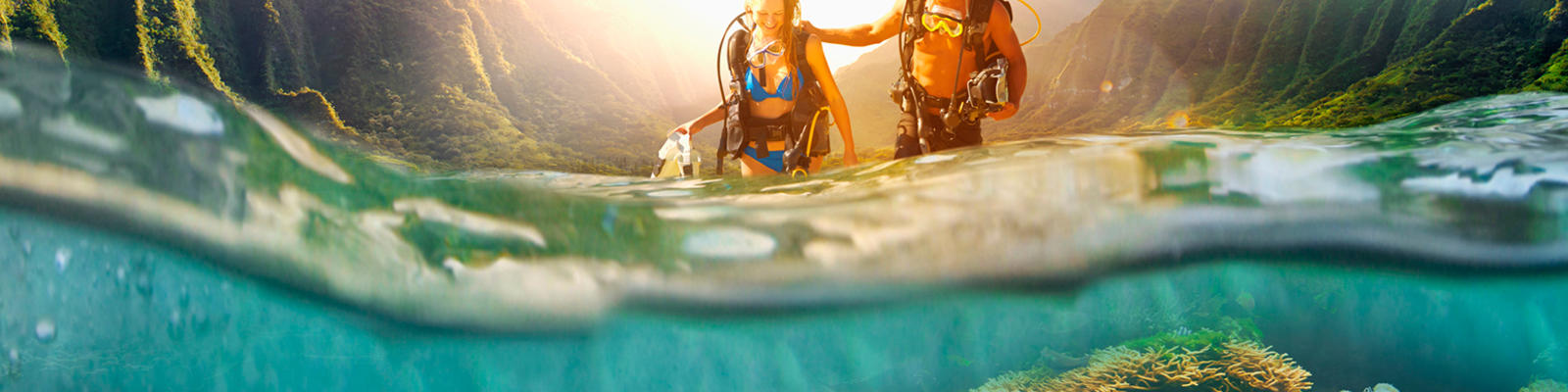 A couple scuba diving in Hawaii