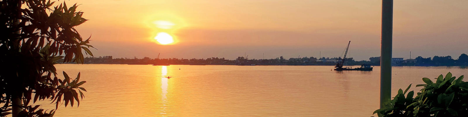 A brilliant sunset on a cruise of the Mekong River through Vietnam and Cambodia