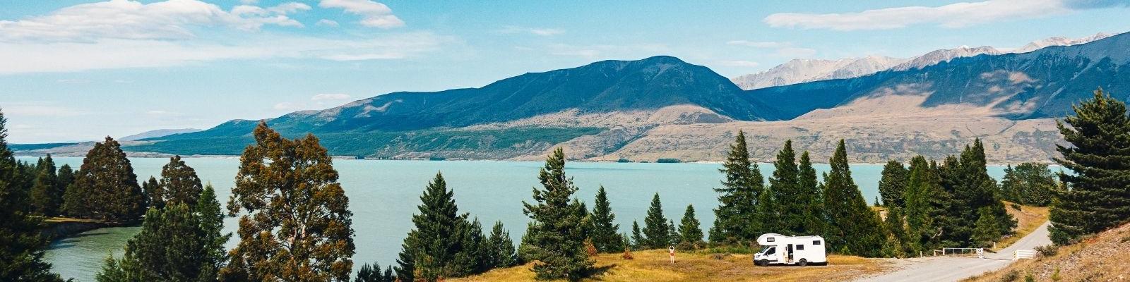 Caravan driving by Lake Pukaki on New Zealand's South Island