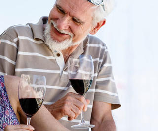 couple drinking red wine on boat