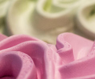 A close up of vanilla and strawberry ice cream