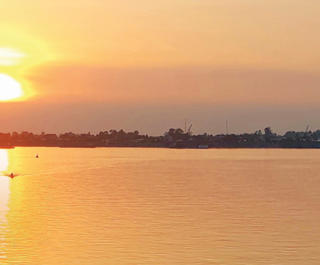 A brilliant sunset on a cruise of the Mekong River through Vietnam and Cambodia