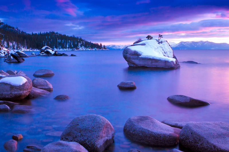 Lake Tahoe at sunrise with a light dusting of snow.